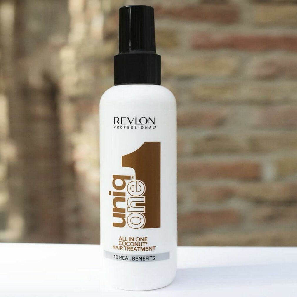 Spray bianco con erogatore nero. Scritta: Revlon Professional Uniq One All in One Coconut Hair Treatment.