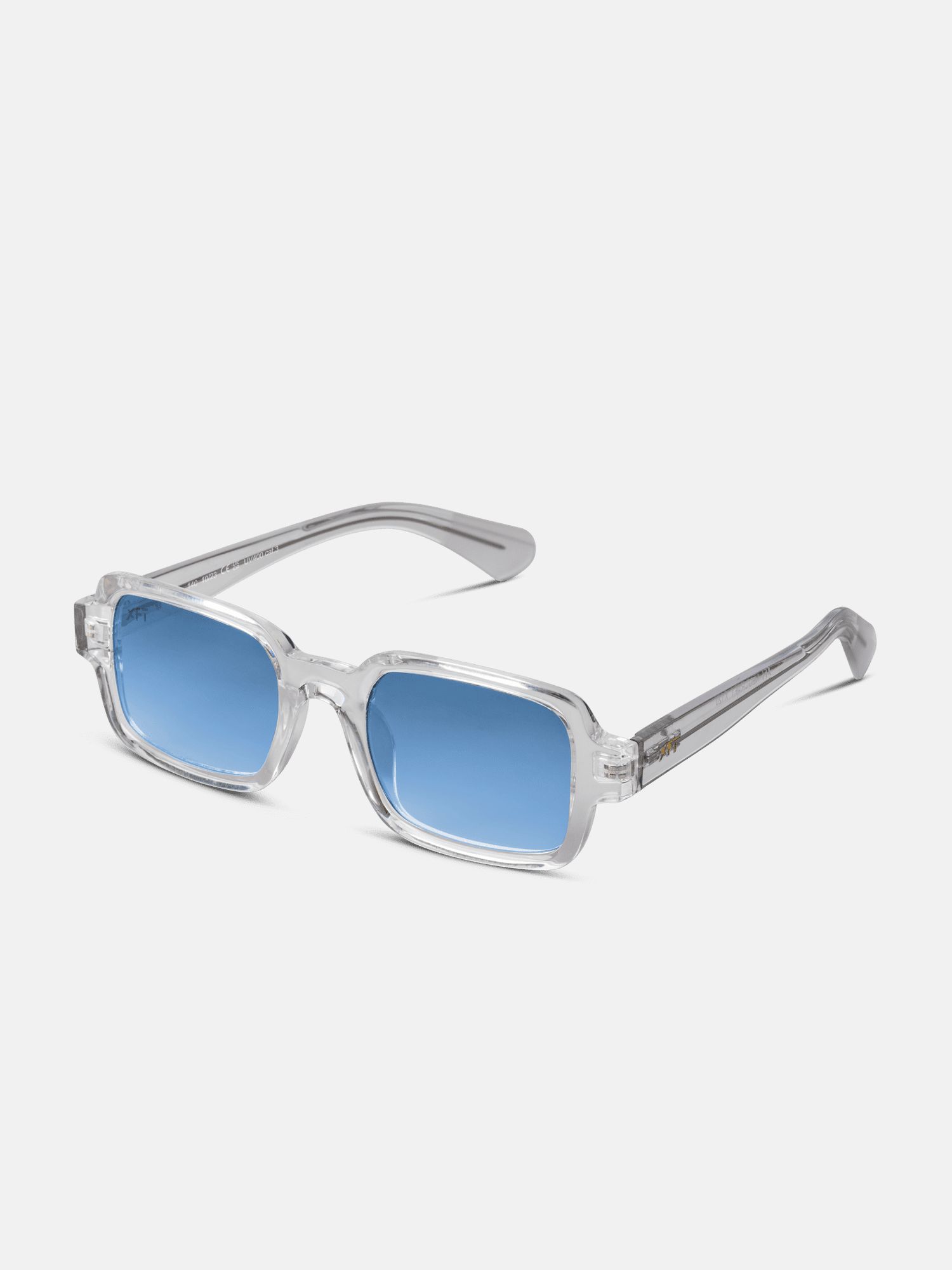 Occhiali da sole con montatura trasparente e lenti blu. Forma rettangolare, logo sull'asta. Modello unisex.