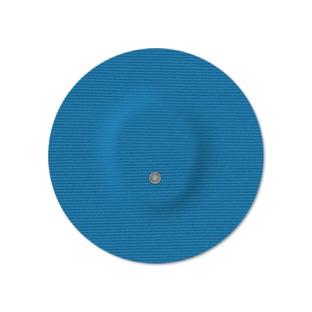 Cerotto rotondo blu con foro centrale. La superficie è strutturata.