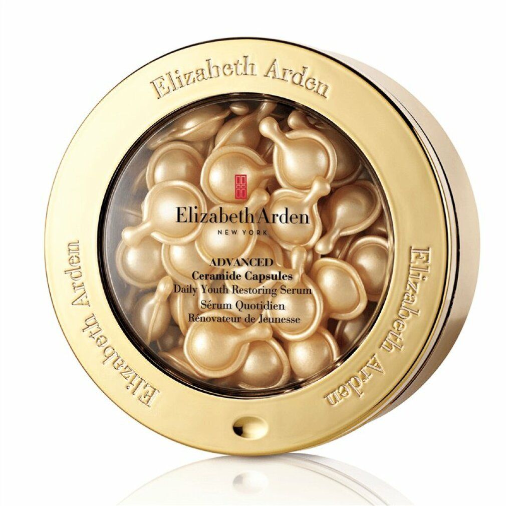 Capsule di siero Elizabeth Arden in scatola dorata. Scatola rotonda con coperchio trasparente. Capsule dorate. Testo: Elizabeth Arden, Advanced Ceramide Capsules.