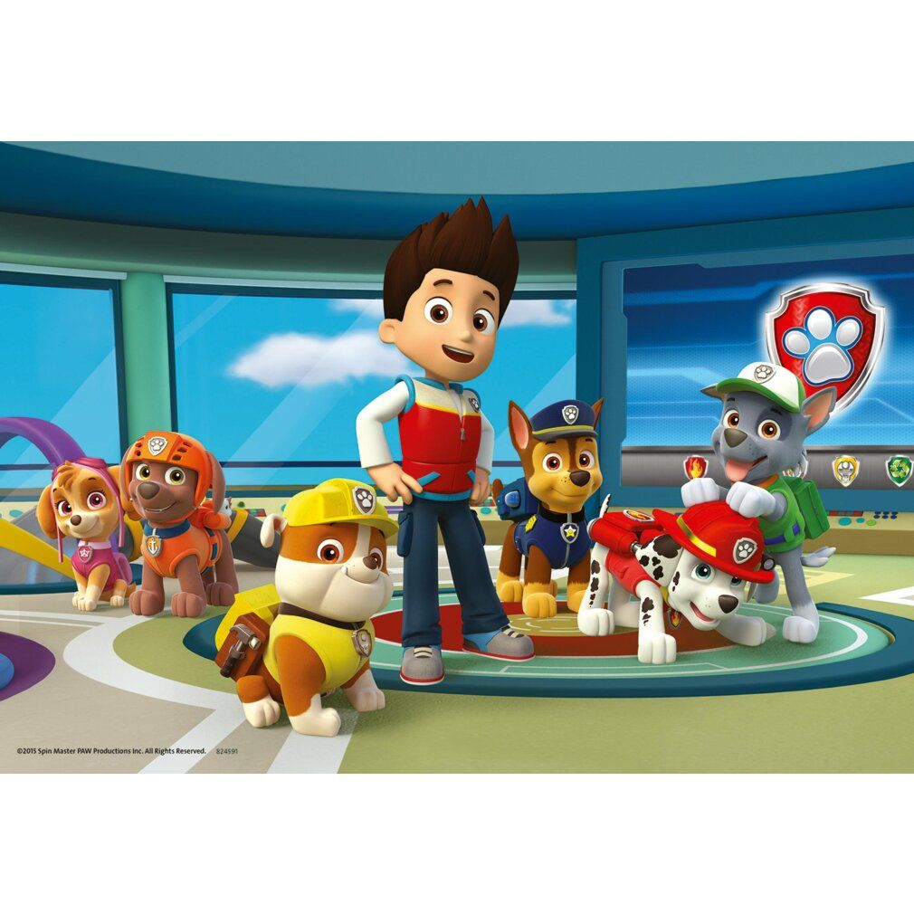 Puzzle Paw Patrol con personaggi. Ragazzo e cani in un interno. Logo e raccomandazione d'età non visibili.