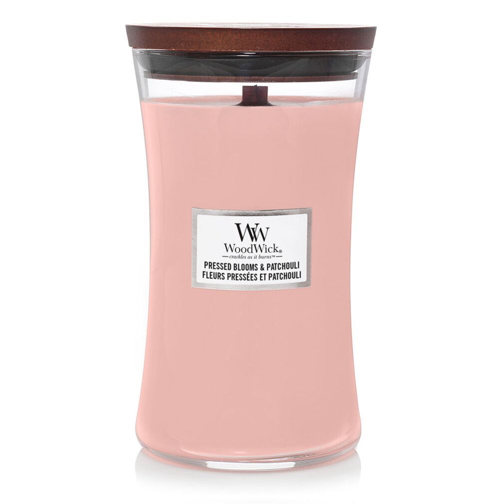 Candela profumata rosa con stoppino in legno e coperchio. Etichetta con nome del prodotto e logo. Contenitore di vetro.