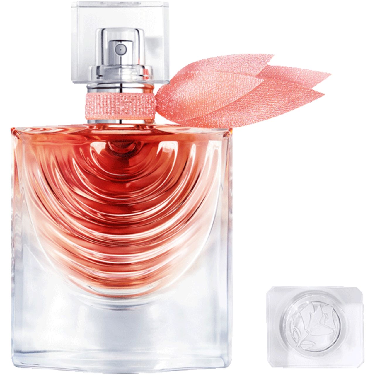 Flacone in vetro con liquido rosa, vaporizzatore, nastro rosa e decorazione. Tappo accanto.