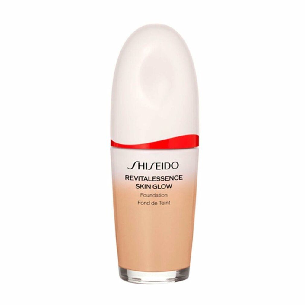 Flacone cosmetico bianco e rosso, sfumatura di colore. Scritta: Shiseido Revitalessence Skin Glow Foundation.