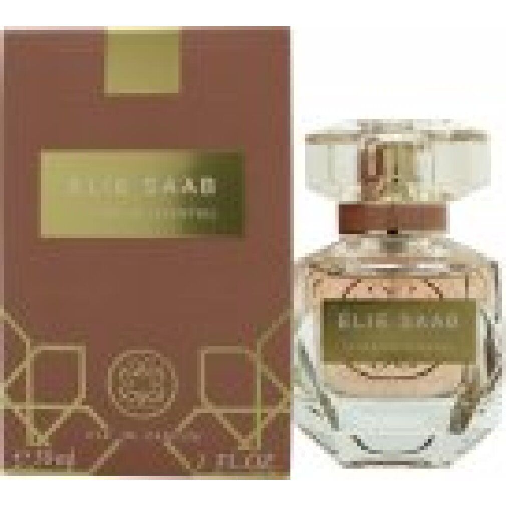 Flacone di profumo e confezione. Scritta: Elie Saab Le Parfum Essentiel. Liquido rosa nel flacone.