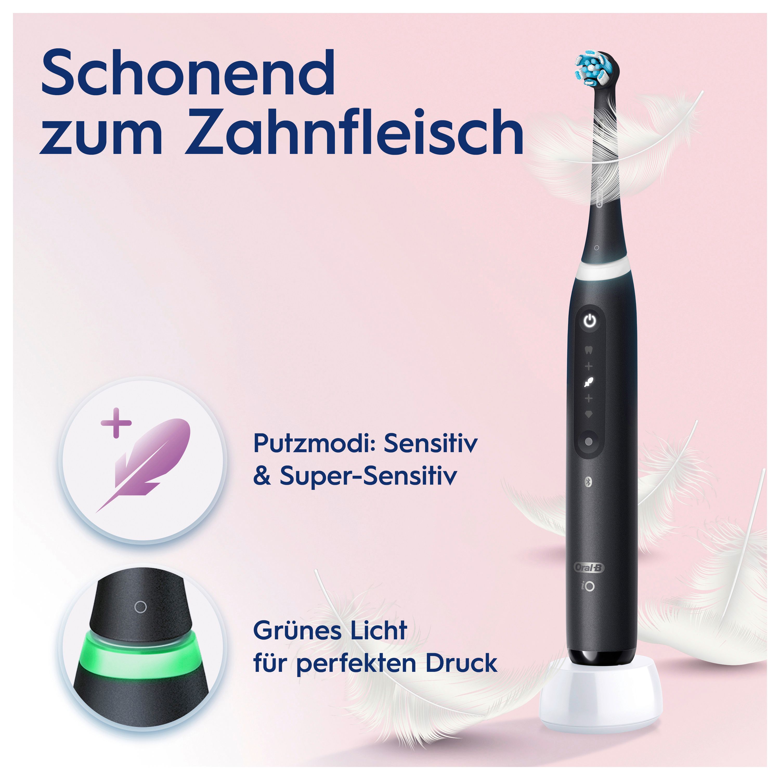 Spazzolino elettrico nero su base di ricarica. Testo e illustrazioni. Luce verde, piume.