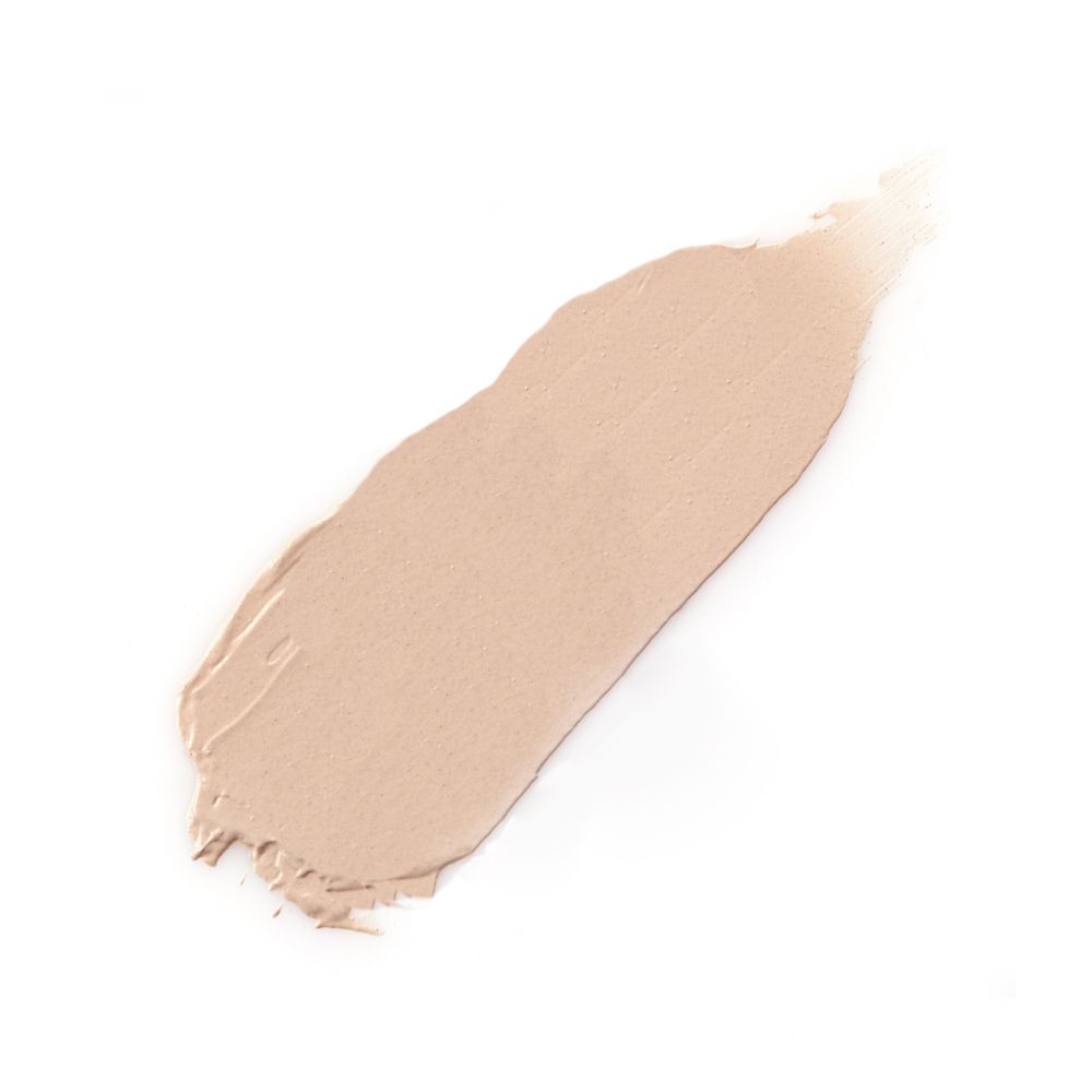 Campione di primer per occhi color crema chiaro su sfondo bianco.