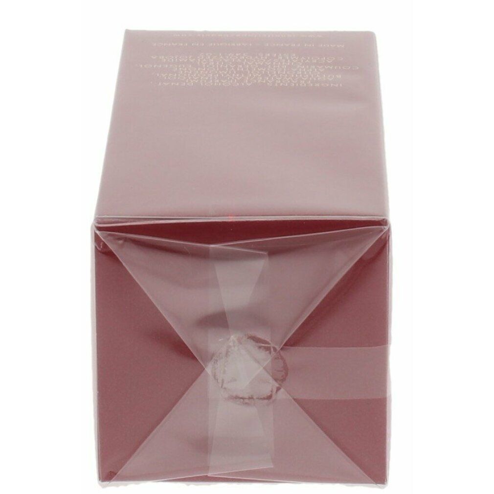 Confezione rettangolare rossa, avvolta in pellicola trasparente. La confezione è chiusa con nastro adesivo sul fondo.