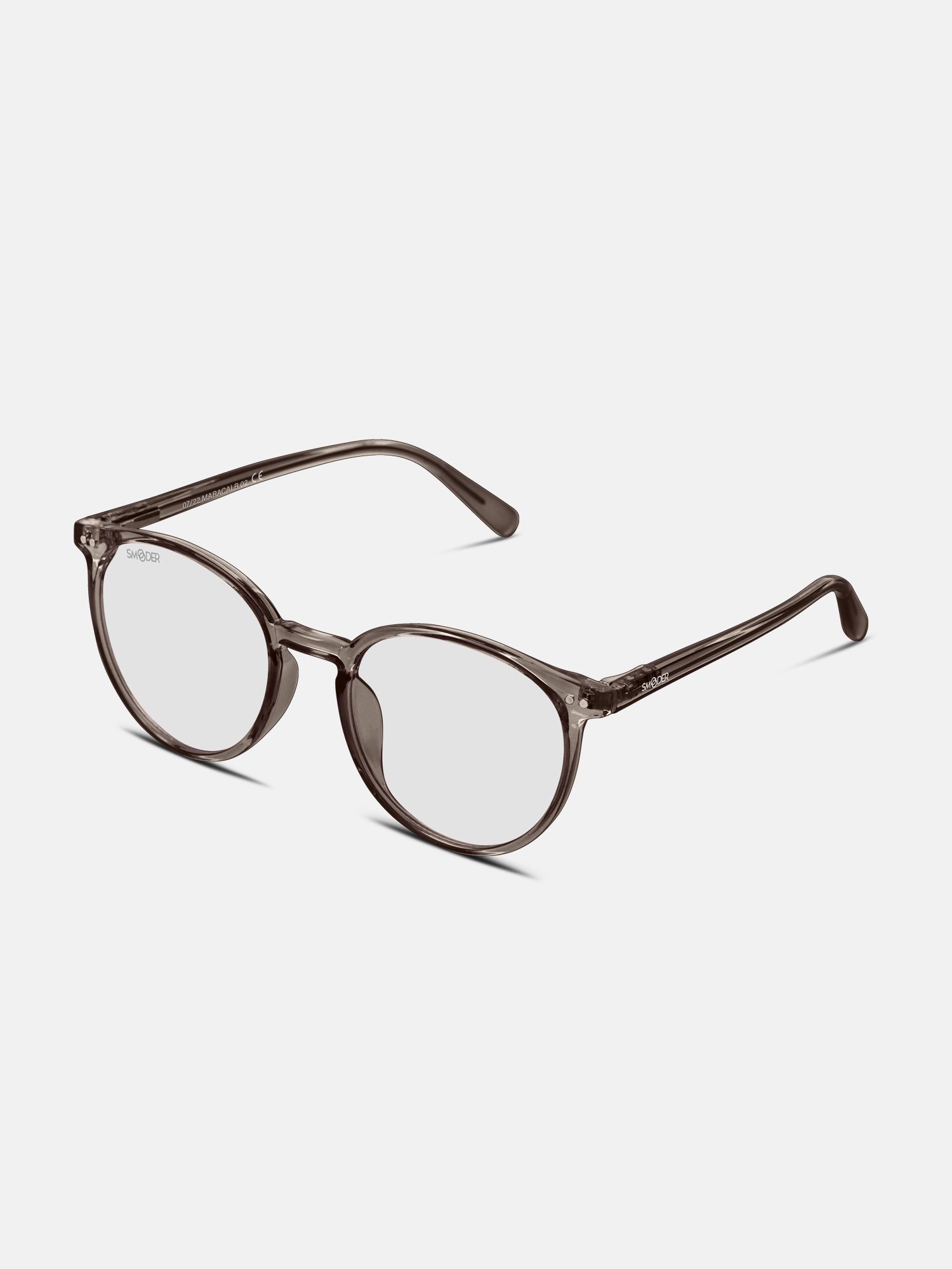 Occhiali grigi con lenti trasparenti. 'SMOODER' sulla stanghetta sinistra. Vista prospettica.