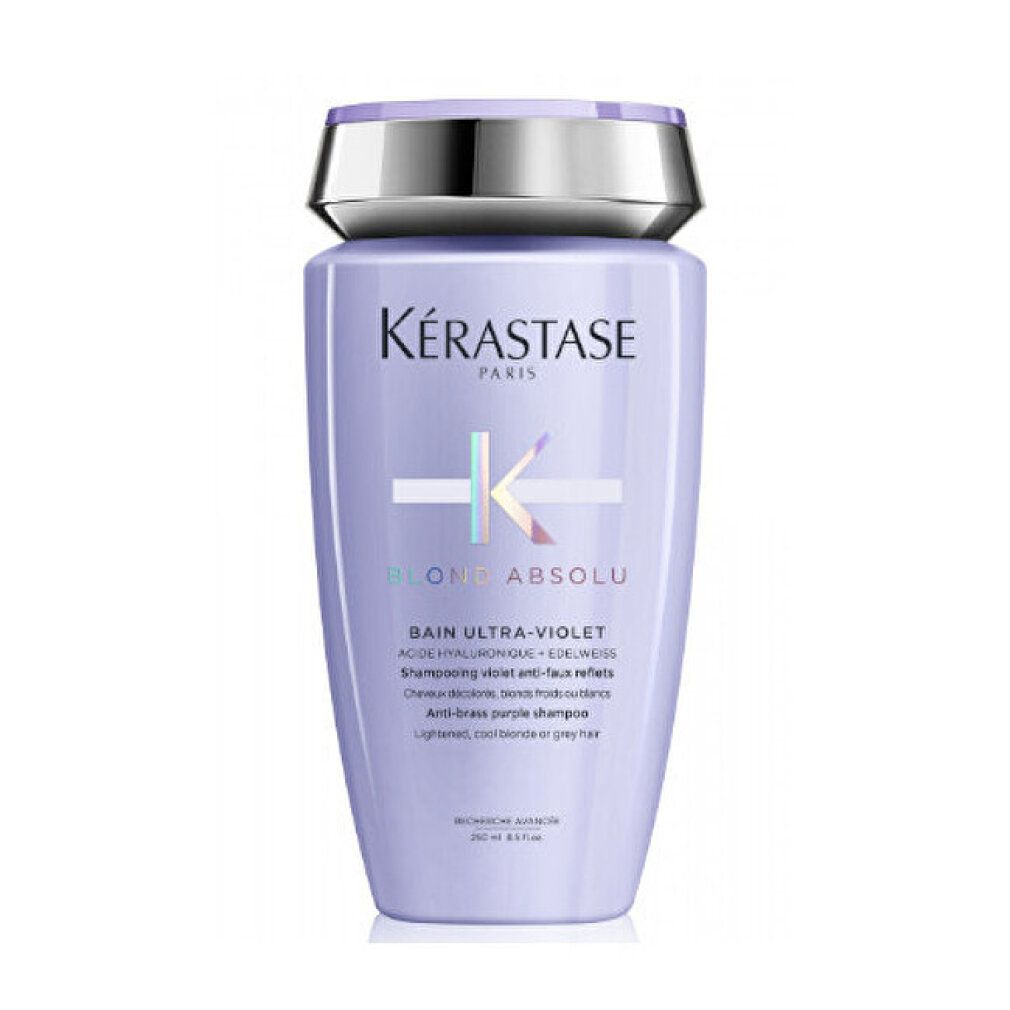 Flacone di shampoo Kérastase Blond Absolu. Flacone viola con tappo argentato. Testo: Bain Ultra-Violet, per capelli biondi o grigi.