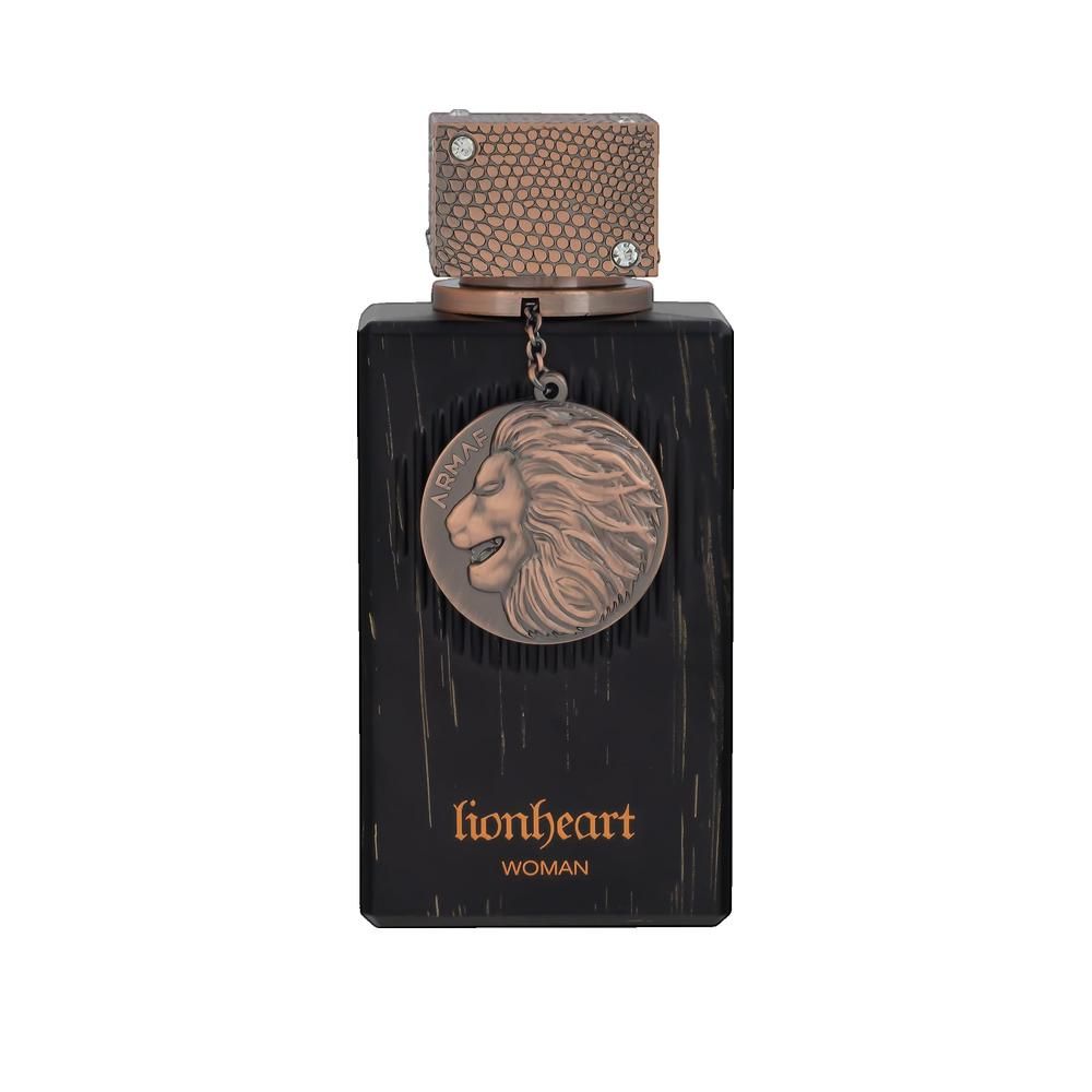 Flacone rettangolare marrone scuro con tappo color rame e ciondolo con leone. Scritta: lionheart woman.