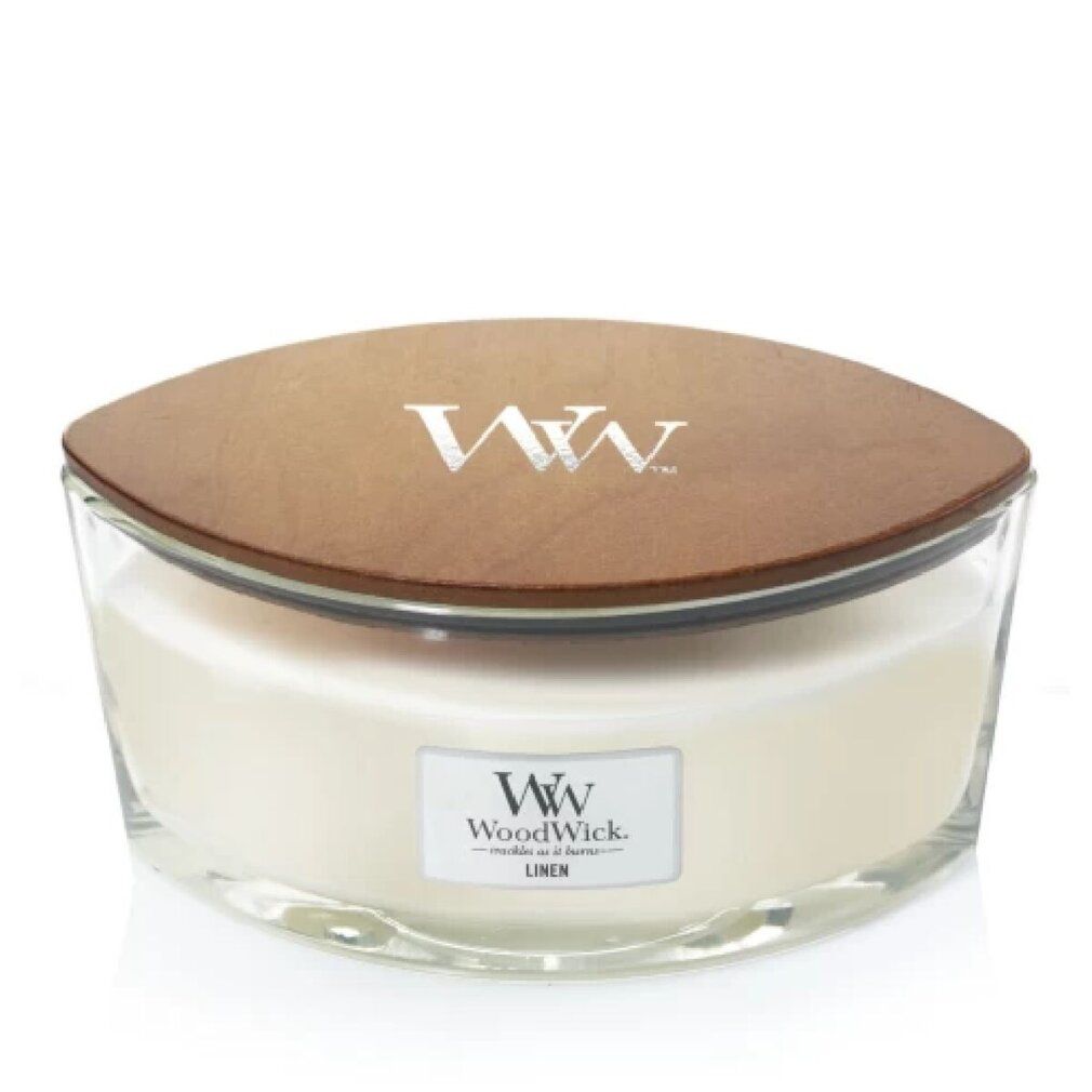 Candela WoodWick Ellipse. Contenitore in vetro, coperchio in legno. Logo WW, scritta 'Linen'. Forma ellittica.