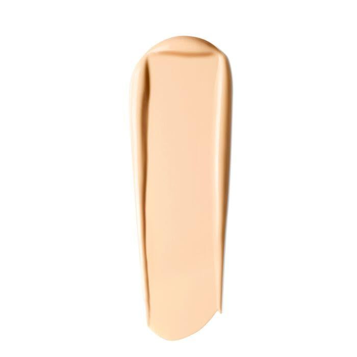 Striscia di fondotinta beige. Texture liscia, forma allungata. Nessun altro dettaglio.