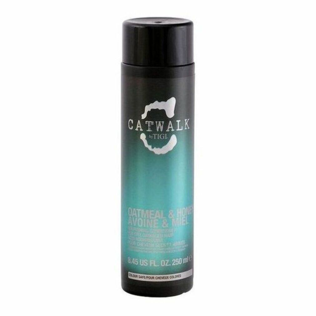 Piccolo flacone nero di balsamo. Scritta: CATWALK by TIGI, OATMEAL & HONEY. 250 ml. Per capelli secchi e danneggiati.