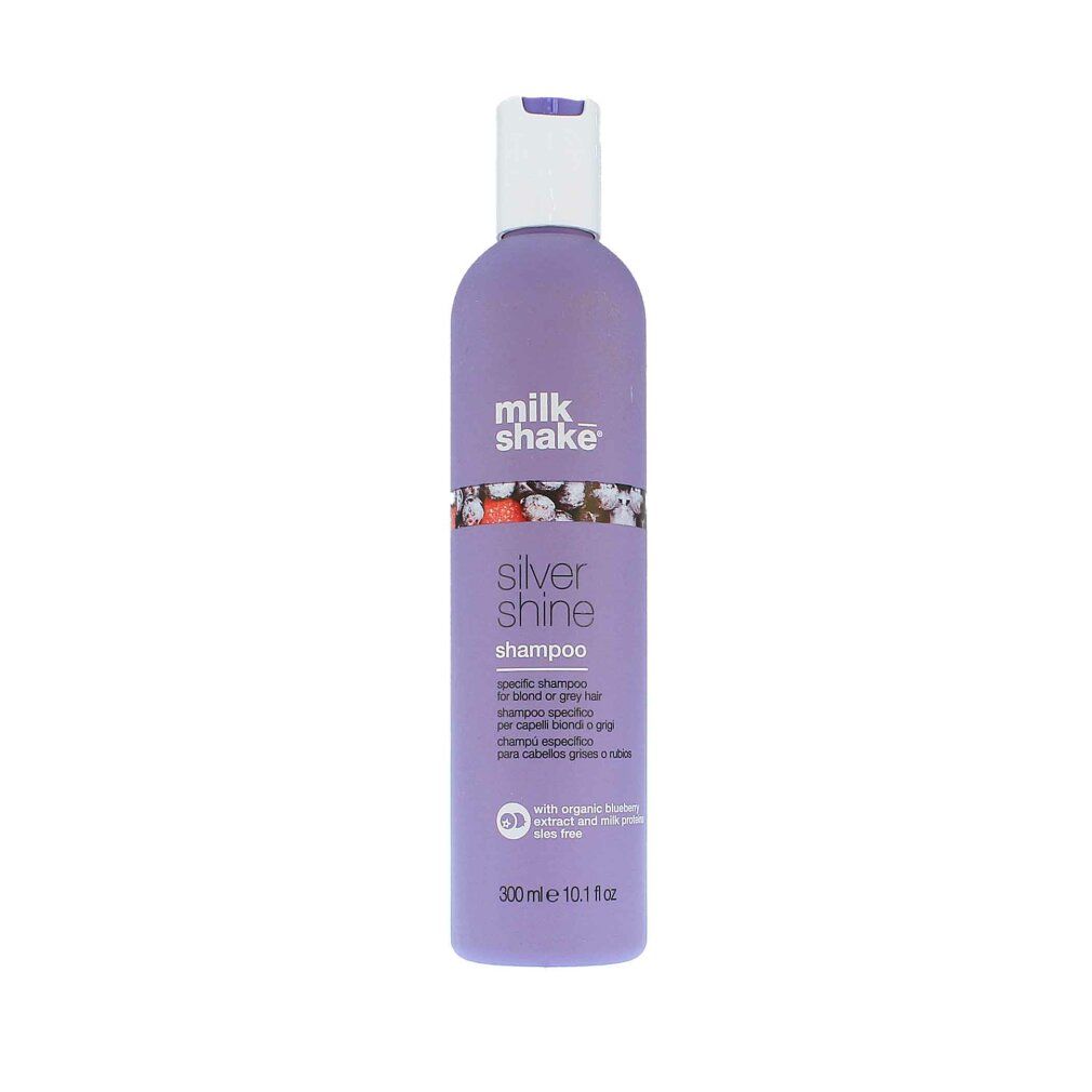 Flacone di shampoo viola con tappo bianco. Scritta: milk_shake, Silver Shine Shampoo. Testo multilingue.