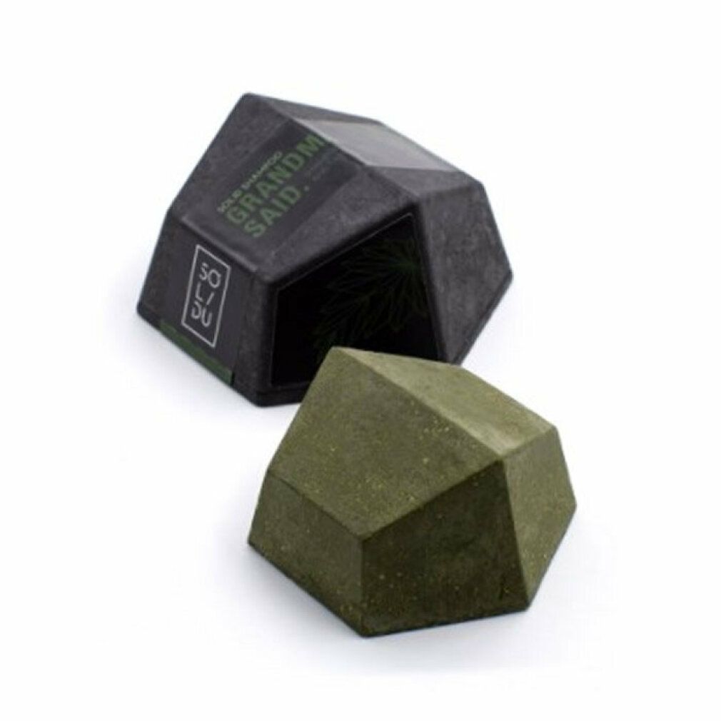 Barra shampoo verde geometrica e confezione nera. Scritta: SOLIDU, GRANDM SAID.