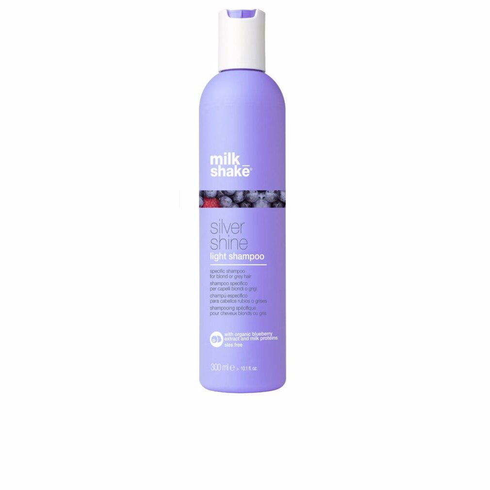 Flacone di shampoo viola, tappo bianco. Scritta: milk_shake, Silver Shine light shampoo. Con mirtillo e proteine del latte.