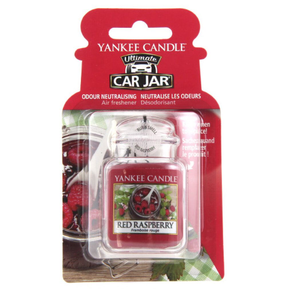 Ultimate Car Jar, profumo per auto. Vasetto rosso con coperchio, etichetta con lamponi. Confezione con foro per appendere. Testo: Yankee Candle, Red Raspberry.