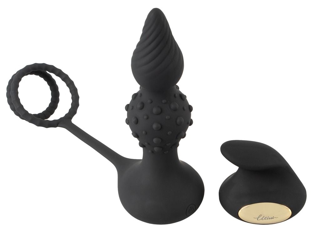 Vibratore anale nero con punta scanalata e bottoni, con un anello.