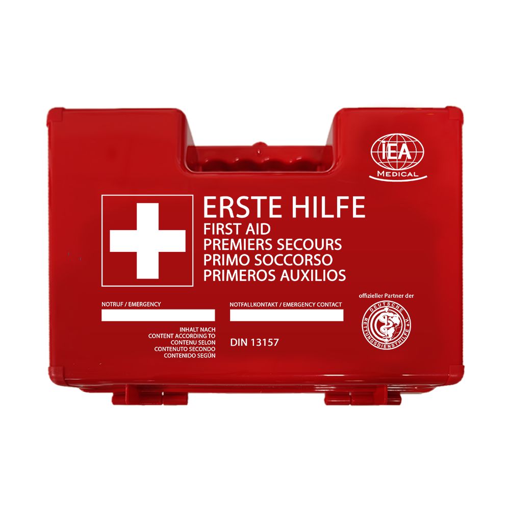 Cassetta di pronto soccorso rossa con croce bianca e testo multilingue. DIN 13157.