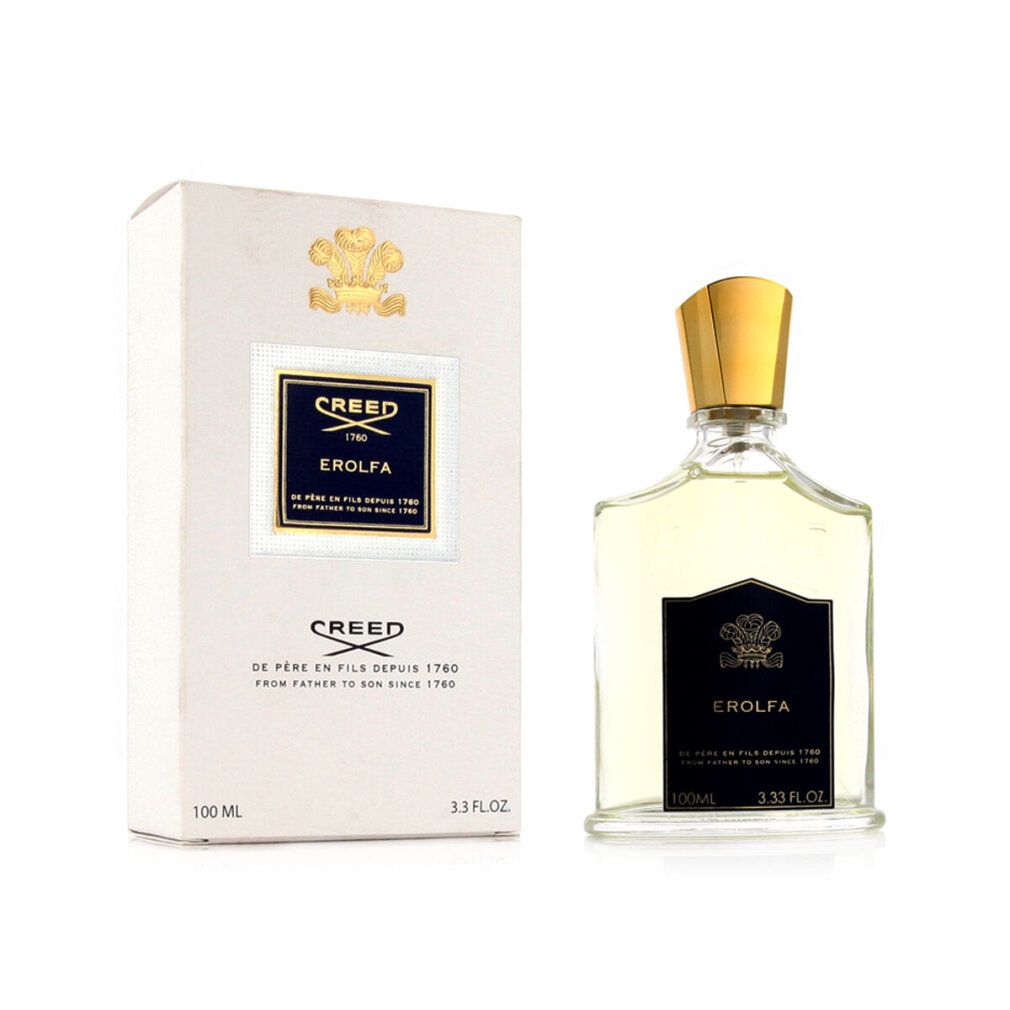 Flacone di profumo accanto a scatola bianca. Flacone con tappo dorato. "CREED" e "EROLFA" visibili.