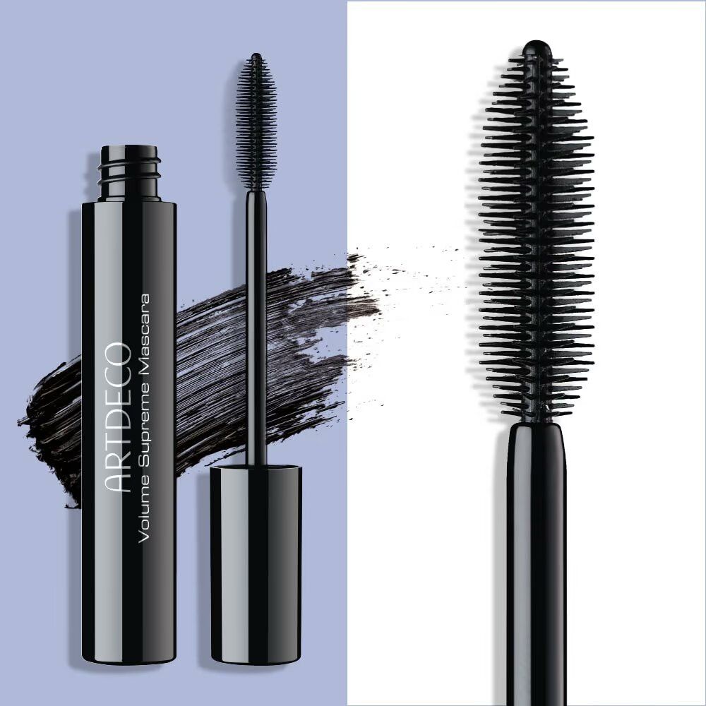 Mascara nero Artdeco Volume Supreme. Tubo aperto, spazzola e macchie di mascara.