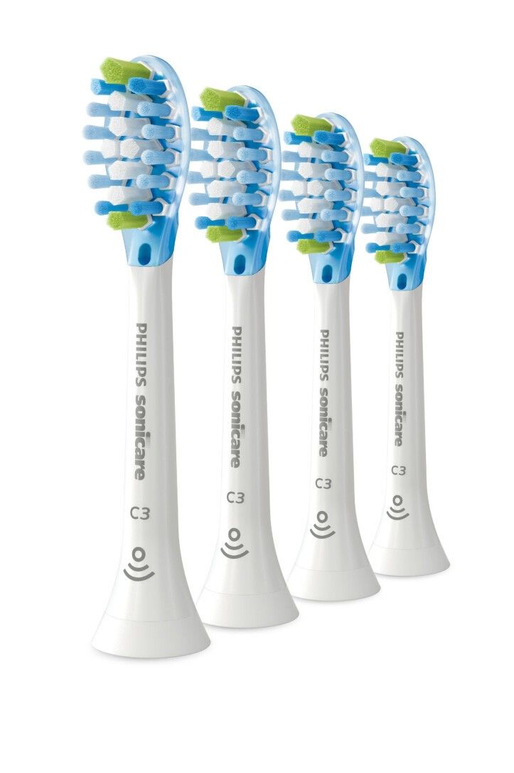 Quattro testine Philips Sonicare C3. Manici bianchi, setole blu e verdi. Loghi C3 e Sonicare visibili.