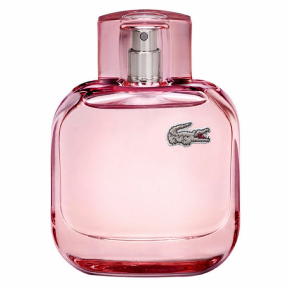 Flacone rosa con vaporizzatore. Logo Lacoste. Forma quadrata con bordi arrotondati. Tappo trasparente.