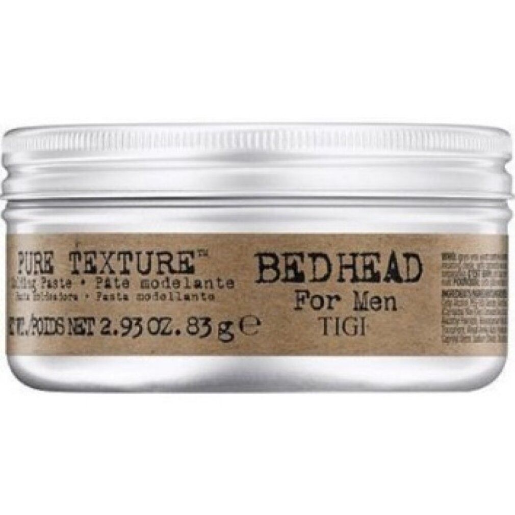 Barattolo cilindrico con coperchio argentato. Etichetta marrone con "PURE TEXTURE" e "Bed Head For Men TIGI". Testo in inglese, spagnolo e francese.