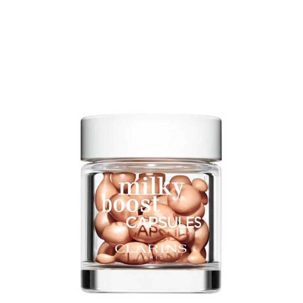 Vasetto di vetro con Clarins Milky Boost Capsules. Capsule visibili.