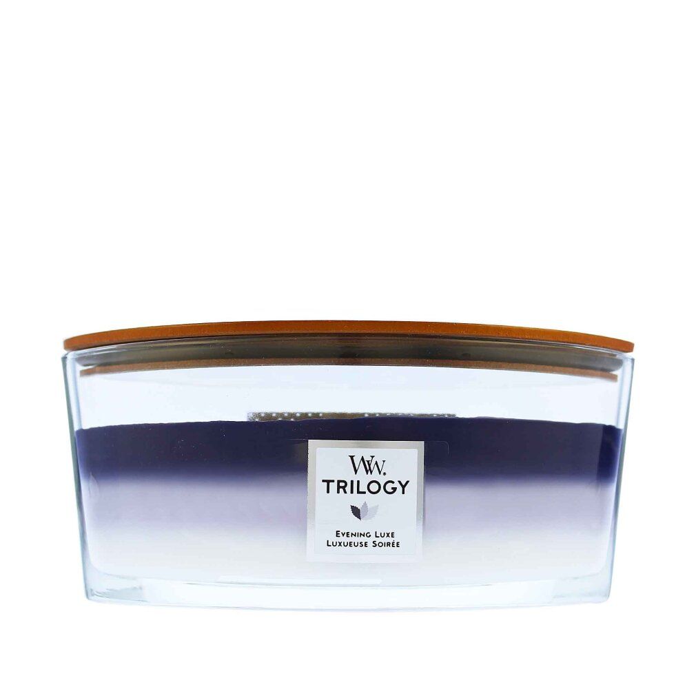 Candela a tre colori in contenitore di vetro con coperchio in legno. Blu scuro, viola e bianco.