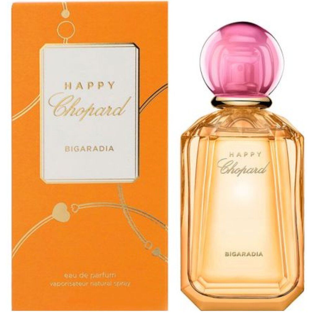 Flacone di profumo e confezione. Scritta: Happy Chopard Bigaradia. Flacone con tappo rosa. Confezione arancione.