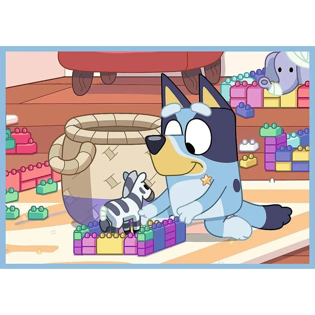 Illustrazione di Bluey che gioca con una zebra e mattoncini. Sfondo: stanza dei giochi con tappeto e giocattoli.