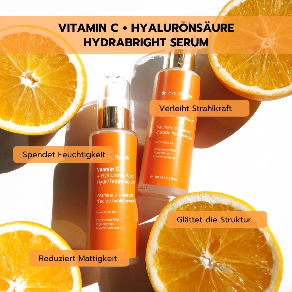 Due flaconi di siero Dr. Eve Ryouth Vitamina C + Acido Ialuronico Hydrabright circondati da spicchi d'arancia.