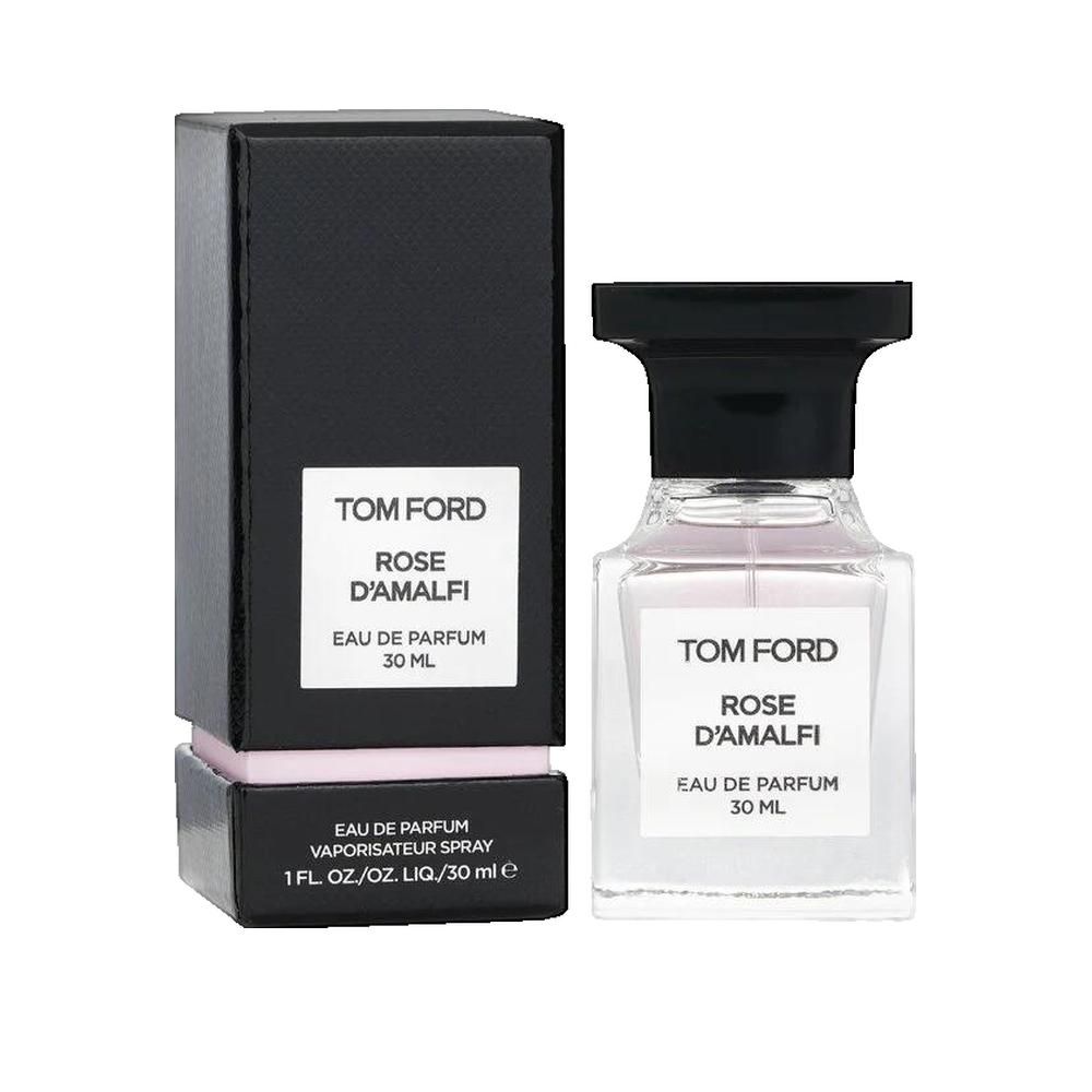 Flacone di profumo e confezione. Scatola nera con etichetta bianca. Scritta: Rose D'Amalfi.