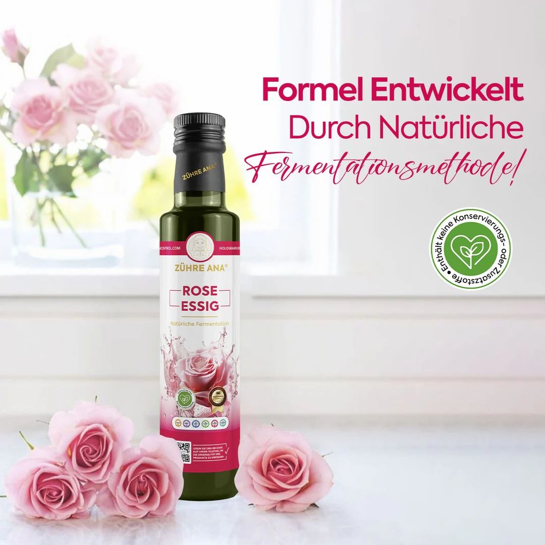 Bottiglia di aceto di rosa accanto a petali di rosa, con testo 'Formel Entwickelt Durch Natürliche Fermentationsmethode'.