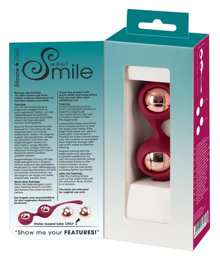 Confezione aperta con due sfere per esercizi pelvici. Testo: Sweet Smile. Sulla confezione: istruzioni per l'uso. Scritta: Water-based lube ONLY.