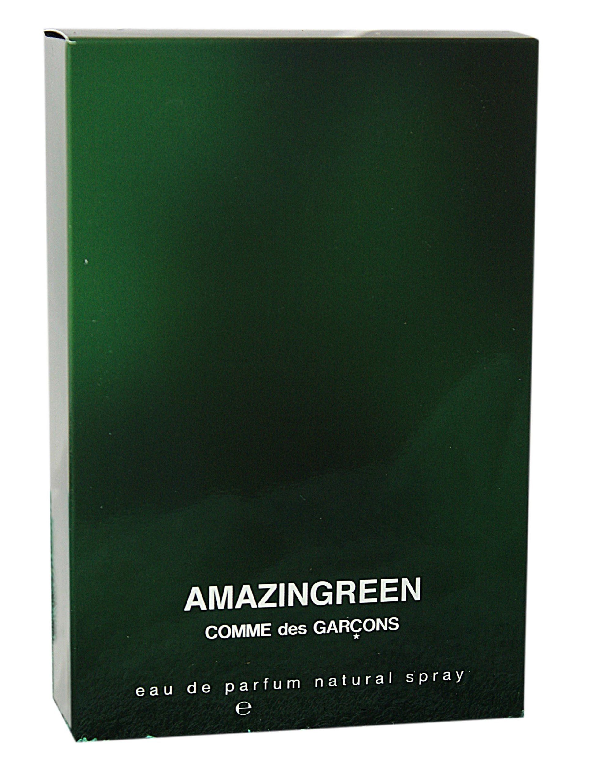 Scatola verde. Scritta: AMAZINGREEN, COMME des GARÇONS, eau de parfum natural spray.