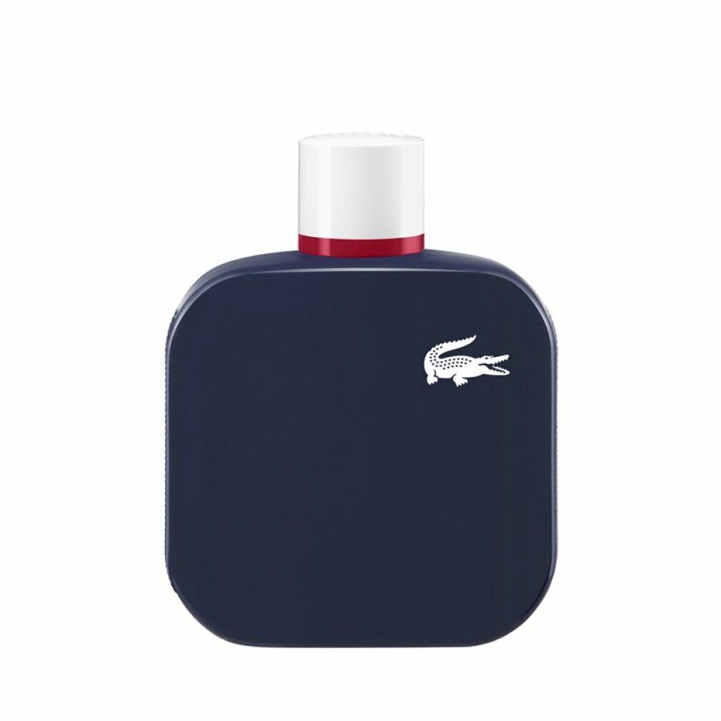 Flacone blu scuro con tappo bianco e anello rosso. Logo coccodrillo bianco. Forma quadrata con angoli arrotondati.