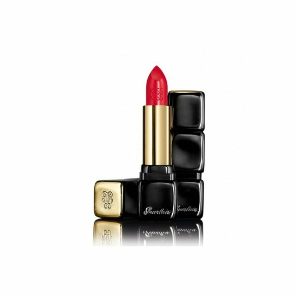 Rossetto rosso aperto, astuccio nero quadrato, parte centrale dorata. Marchio e riflesso visibili.