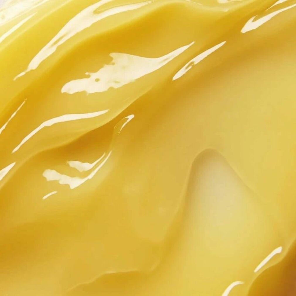 Primo piano di balsamo giallo. Texture liscia e ondulata con riflessi lucidi.