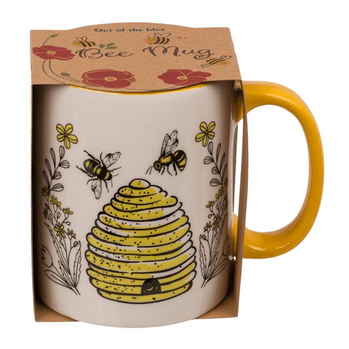 Tazza in ceramica nella sua confezione. Manico giallo, motivo api e alveare. Scritta 'Bee Mug'.
