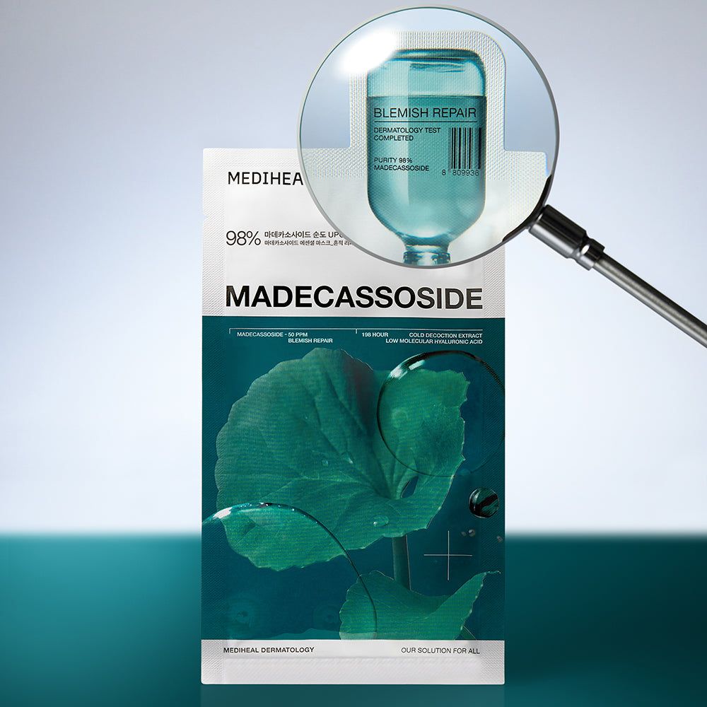 Confezione MEDIHEAL Madecassoside Essential Mask sotto una lente d'ingrandimento. Testo: Madecassoside, 98%, Blemish Repair.