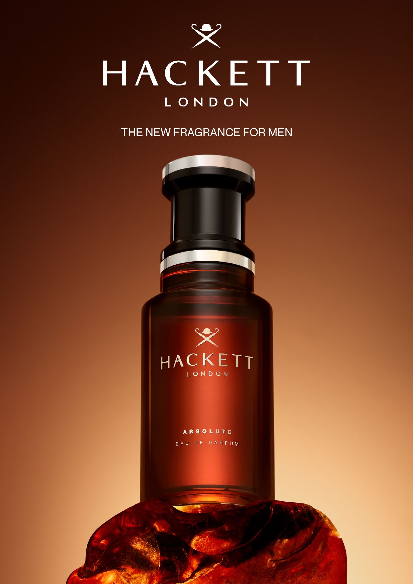 Flacone di profumo su sfondo ambrato. Scritta: Hackett London, Absolute Eau de Parfum. Testo: The New Fragrance for Men.