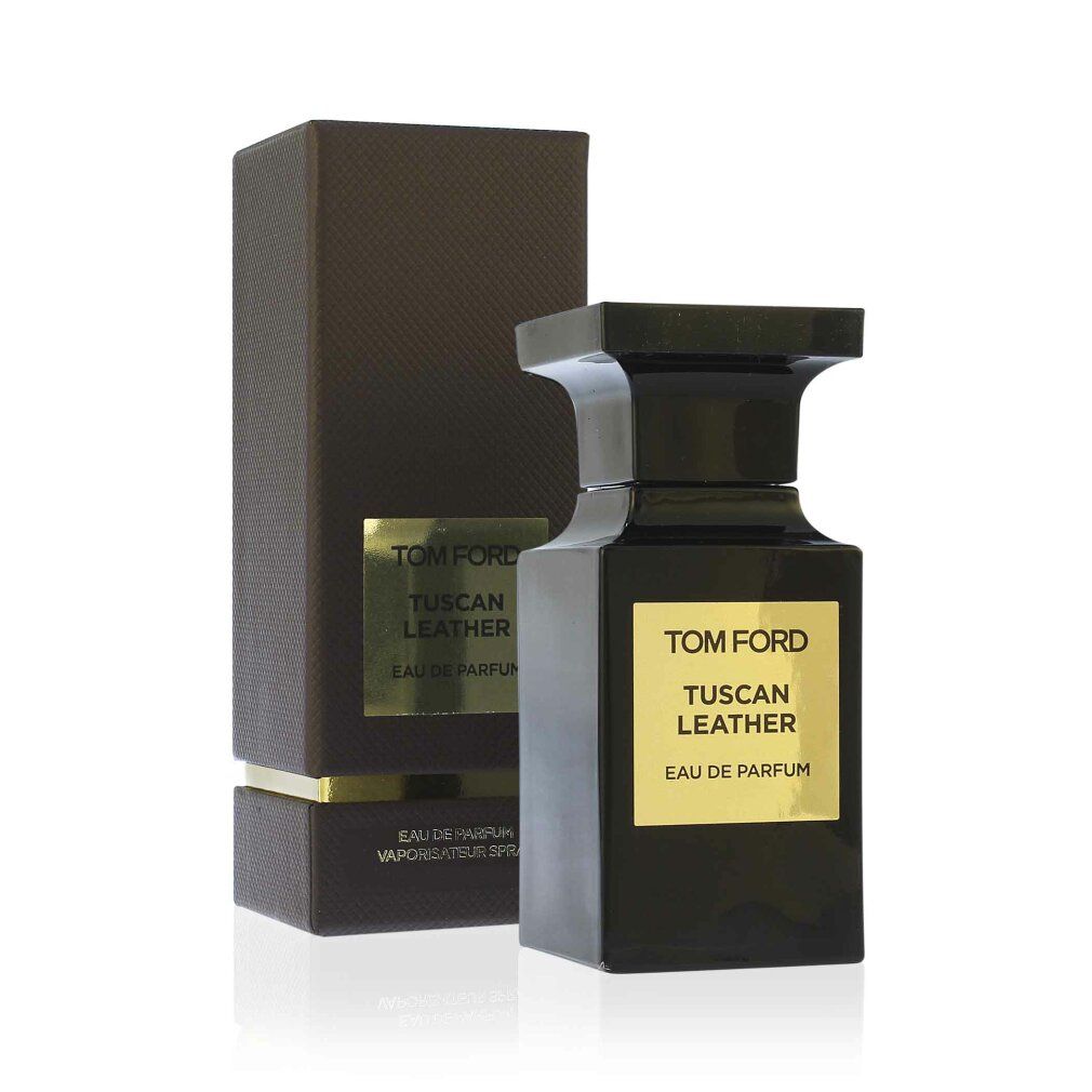 Flacone nero accanto a una scatola nera. Etichetta dorata con scritta: TOM FORD TUSCAN LEATHER.