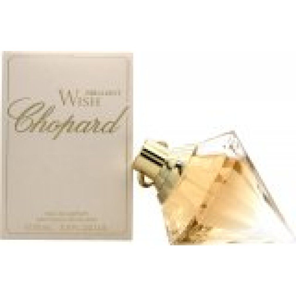 Flacone di profumo e confezione. Tappo dorato, scritta "Chopard". Forma angolare, flacone in vetro trasparente.