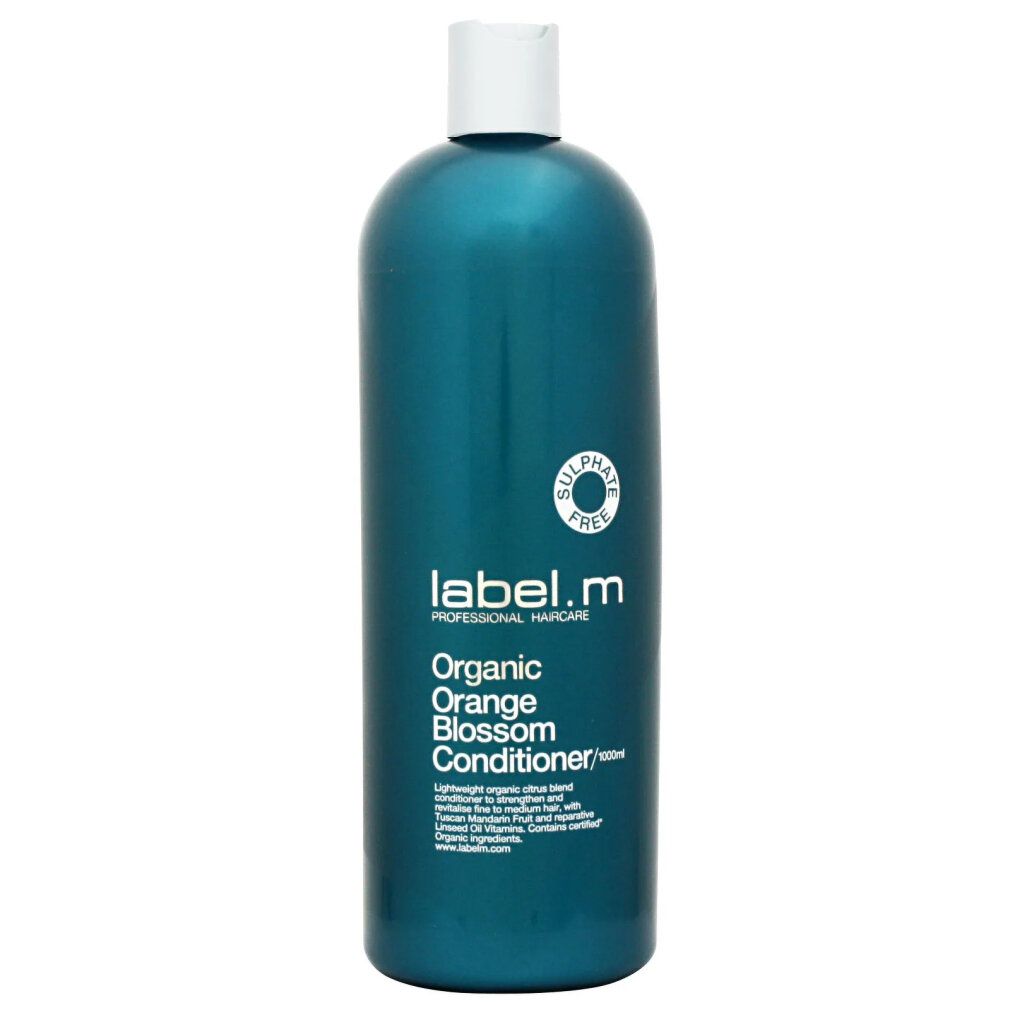 Flacone turchese con tappo bianco. Scritta: Label.m, Organic Orange Blossom Conditioner. Contiene testo.
