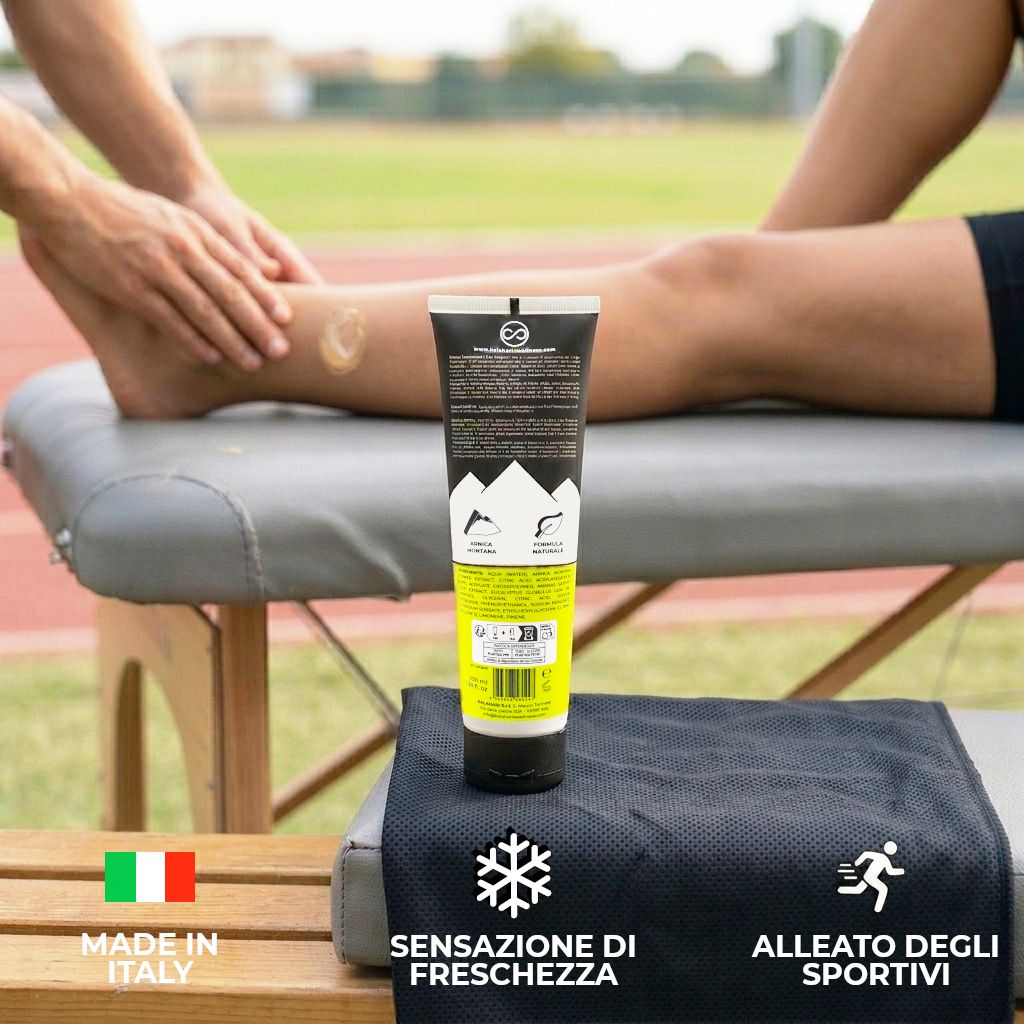Tubo Gel Arnica 98% Estrema su lettino vicino alla gamba di un atleta.