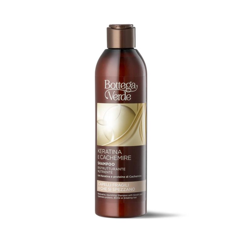 Flacone di shampoo marrone con etichetta. Testo: Bottega Verde, Keratina e Cachemire, Shampoo ristrutturante nutriente.