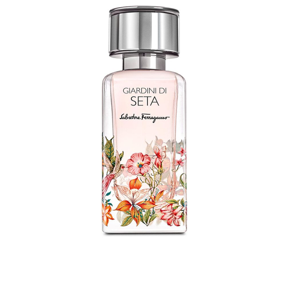 Flacone di profumo con design floreale. Scritta: Giardini Di Seta, Salvatore Ferragamo. Tappo argentato.